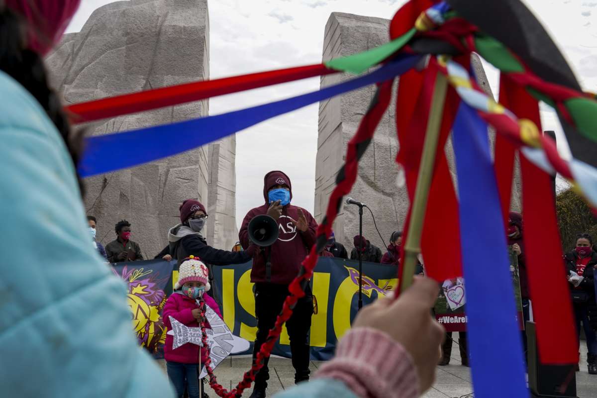 Activists honor Black immigrants who were recently deported at the Martin Luther King, Jr. Memorial in Washington D.C.