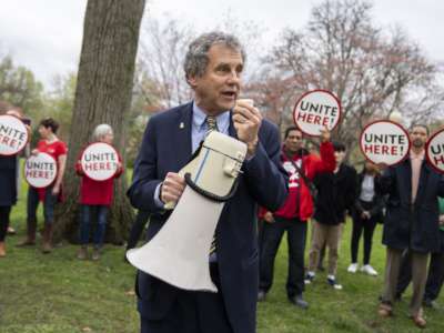 Sen. Sherrod Brown speaks at a rally on Capitol Hill with Senate cafeteria workers and UNITE HERE Local 23 and 25 union members, as funding was appropriated to protect their jobs on April 6, 2022.