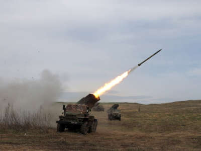 a rocket launcher launches rockets in Ukraine against Russian troops' position