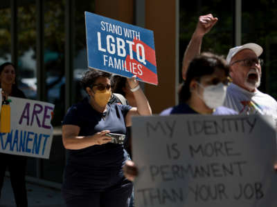 People protest in front of Florida State Senator Ileana Garcia's office after the passage of the Parental Rights in Education bill, dubbed the "Don't Say Gay" bill by LGBTQ activists on March 9, 2022, in Miami, Florida.