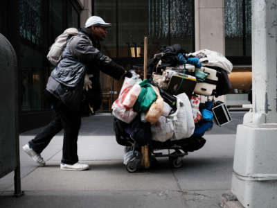 A homeless man walks through Manhattan on March 31, 2022, in New York City.