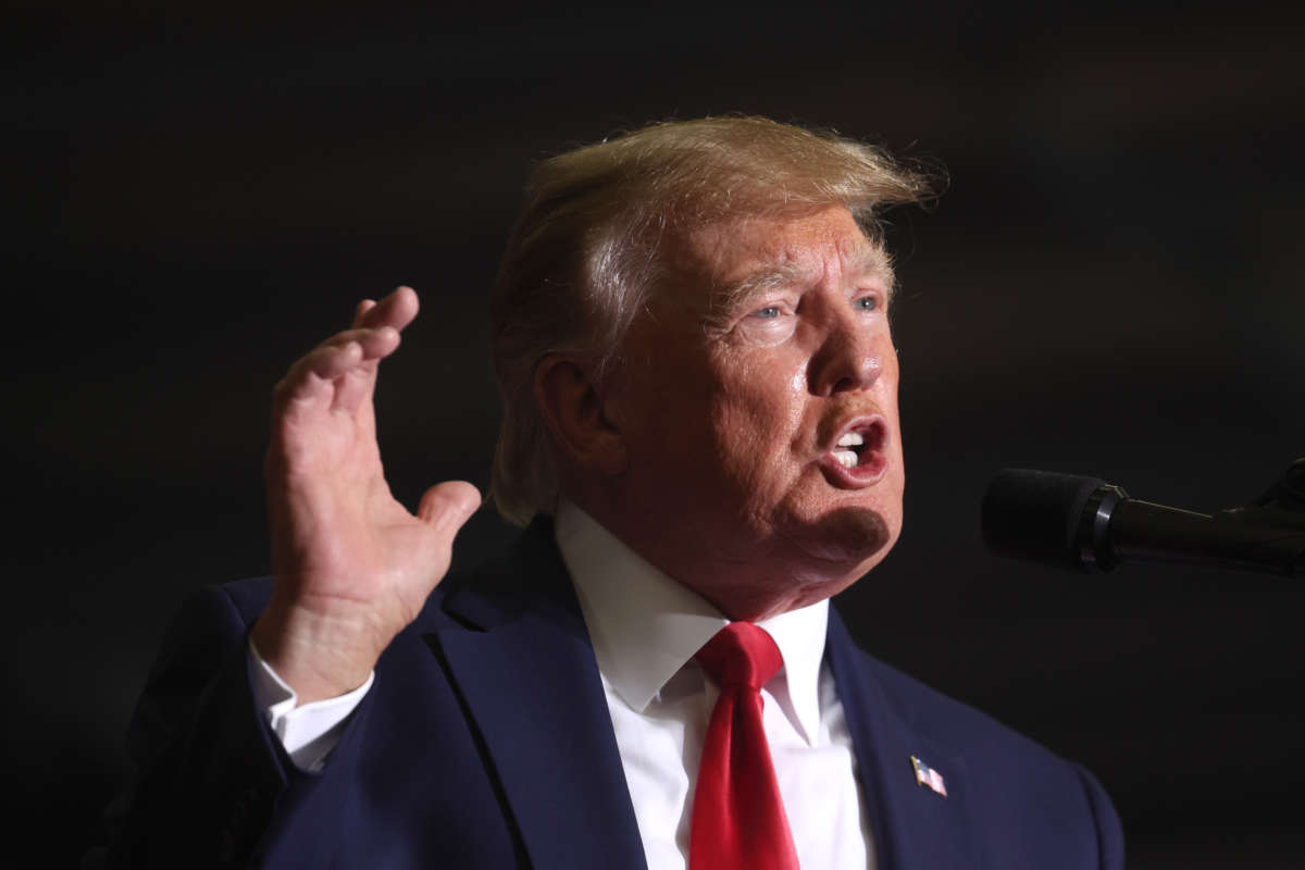 Former President Donald Trump speaks to supporters at a rally on April 2, 2022, near Washington, Michigan.