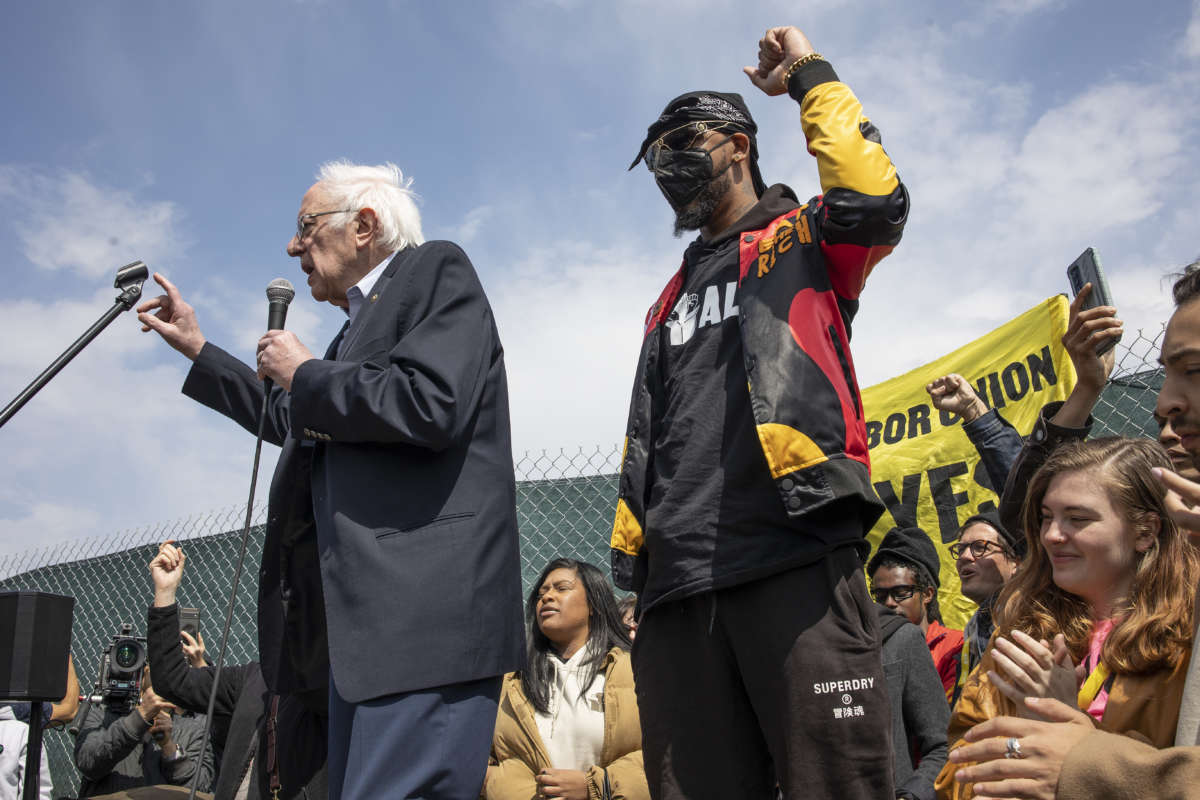 Sen. Bernie Sanders joins Amazon Labor Union President Chris Smalls at a rally on the eve of the union election for the LDJ5 Amazon sorting center on April 24, 2022, in Staten Island, New York. Smalls successfully organized the JFK8 Amazon fulfillment center across the street, making it the first Amazon warehouse to unionize.