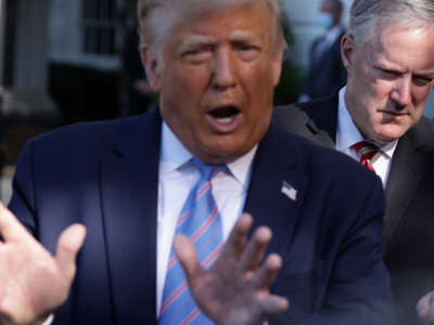 President Donald Trump speaks as White House Chief of Staff Mark Meadows listens prior to Trump's Marine One departure from the South Lawn of the White House on July 29, 2020, in Washington, D.C.