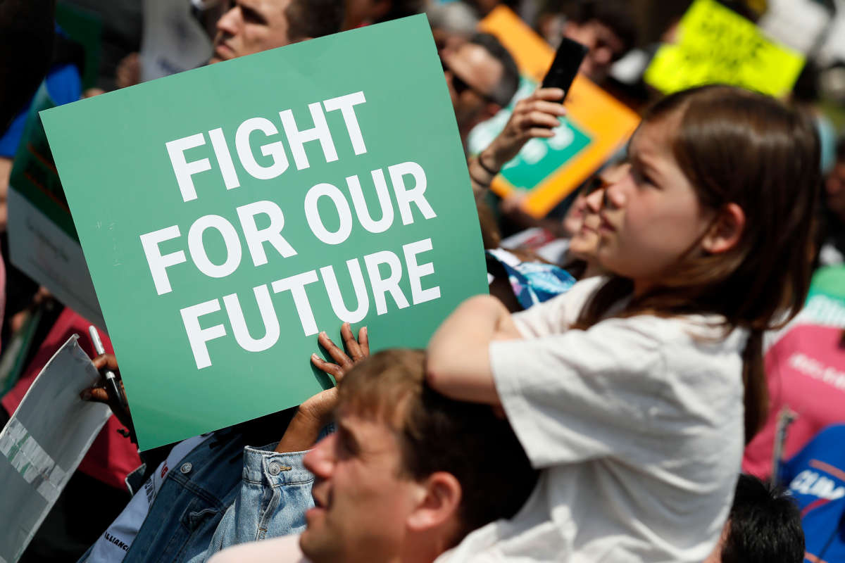 Activists protest at the Fight for Our Future: Rally for Climate, Care, Jobs & Justice in Lafayette Square near The White House on April 23, 2022, in Washington, D.C.