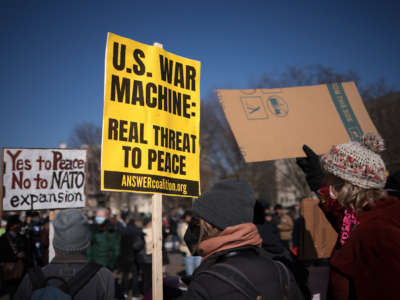 Antiwar protesters gather in front of the White House to demonstrate against escalating tensions between the United States and Russia on January 27, 2022, in Washington, D.C. The protest was organized by the activist group CODEPINK.