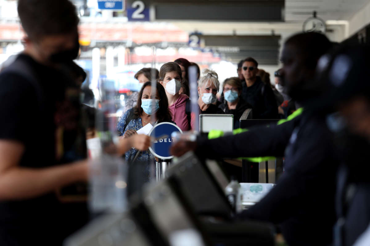 Passengers make their way through Delta Airlines Terminal Two at Los Angeles International Airport on April 19, 2022, in Los Angeles, California.