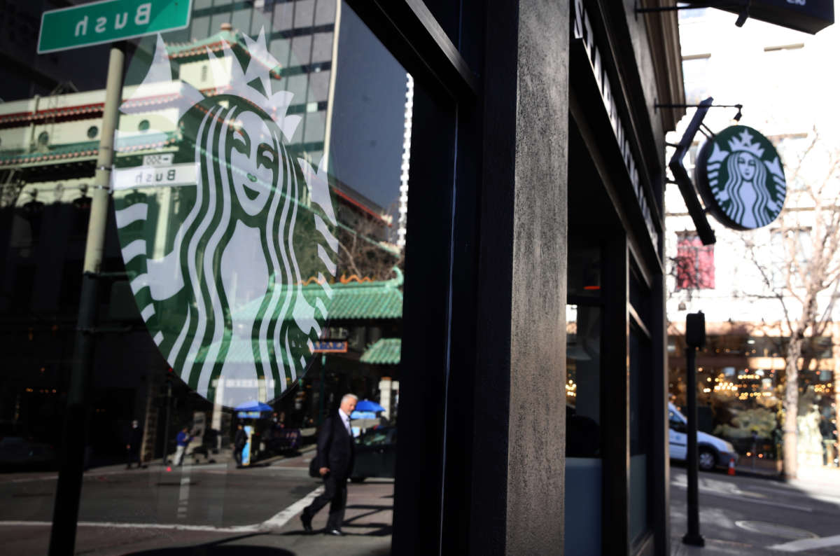 The Starbucks logo is displayed in the window of a Starbucks Coffee shop on January 24, 2019, in San Francisco, California.