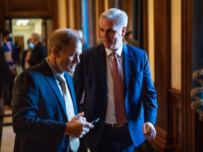 House Minority Leader Kevin McCarthy, right, speaks with Rep. Jim Jordan as they walk to a press conference on November 17, 2021, in Washington, D.C.