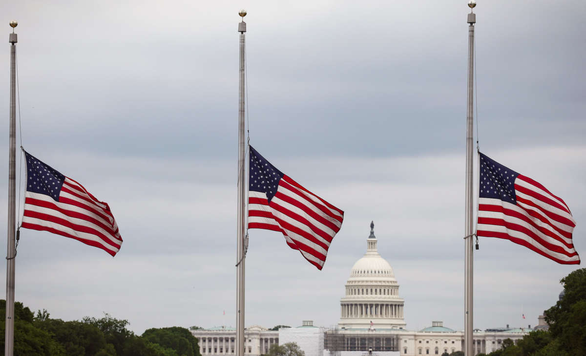 Flags fly at half mast for the one million people in the u.s. killed by covid