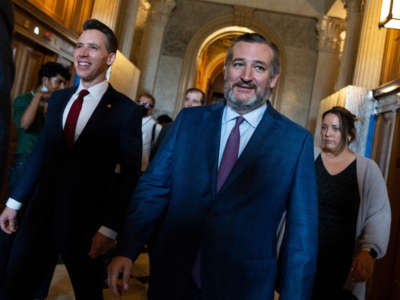 Senators Ted Cruz, right, and Josh Hawley are seen outside the Senate chamber on May 3, 2022.