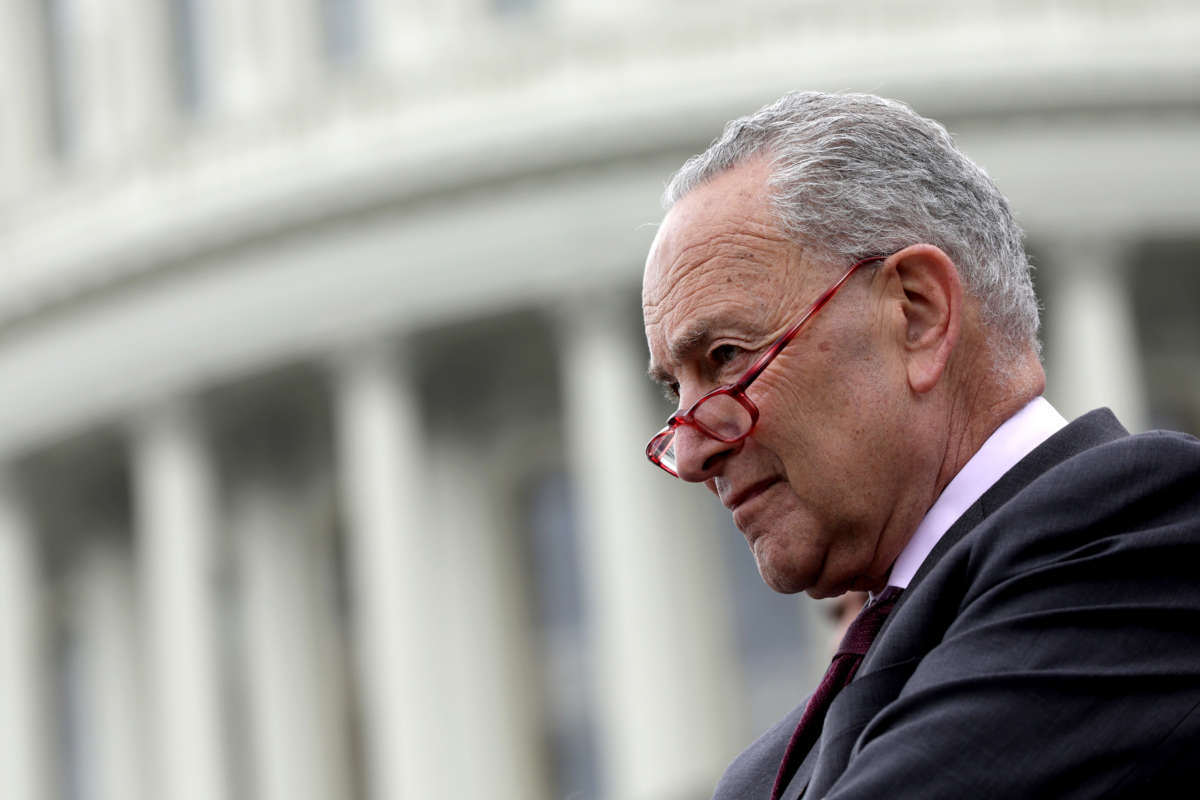 Senate Majority Leader Sen. Chuck Schumer listens during an event on the steps of the U.S. Capitol on May 3, 2022, in Washington, D.C.