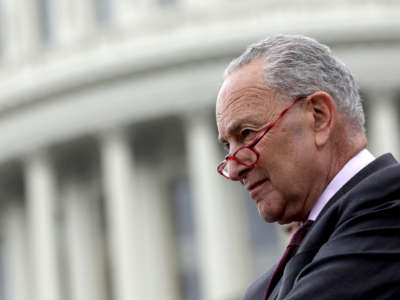 Senate Majority Leader Sen. Chuck Schumer listens during an event on the steps of the U.S. Capitol on May 3, 2022, in Washington, D.C.