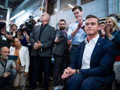 Rep. Madison Cawthorn talks with reporters and supporters as results from the North Carolina primary election continue to report in at his campaign headquarters on May 17, 2022, in Hendersonville, North Carolina.