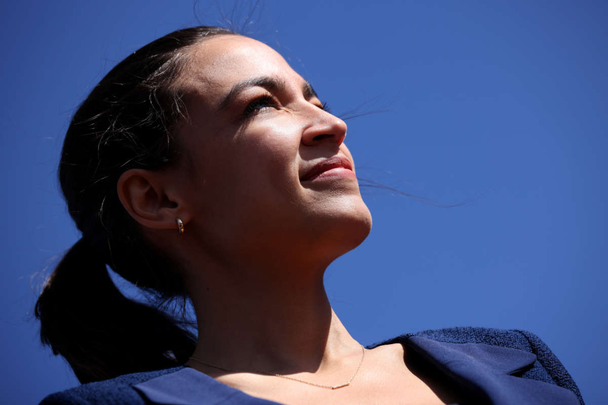 Rep. Alexandria Ocasio-Cortez listens to speakers during an event outside Union Station June 16, 2021, in Washington, D.C.