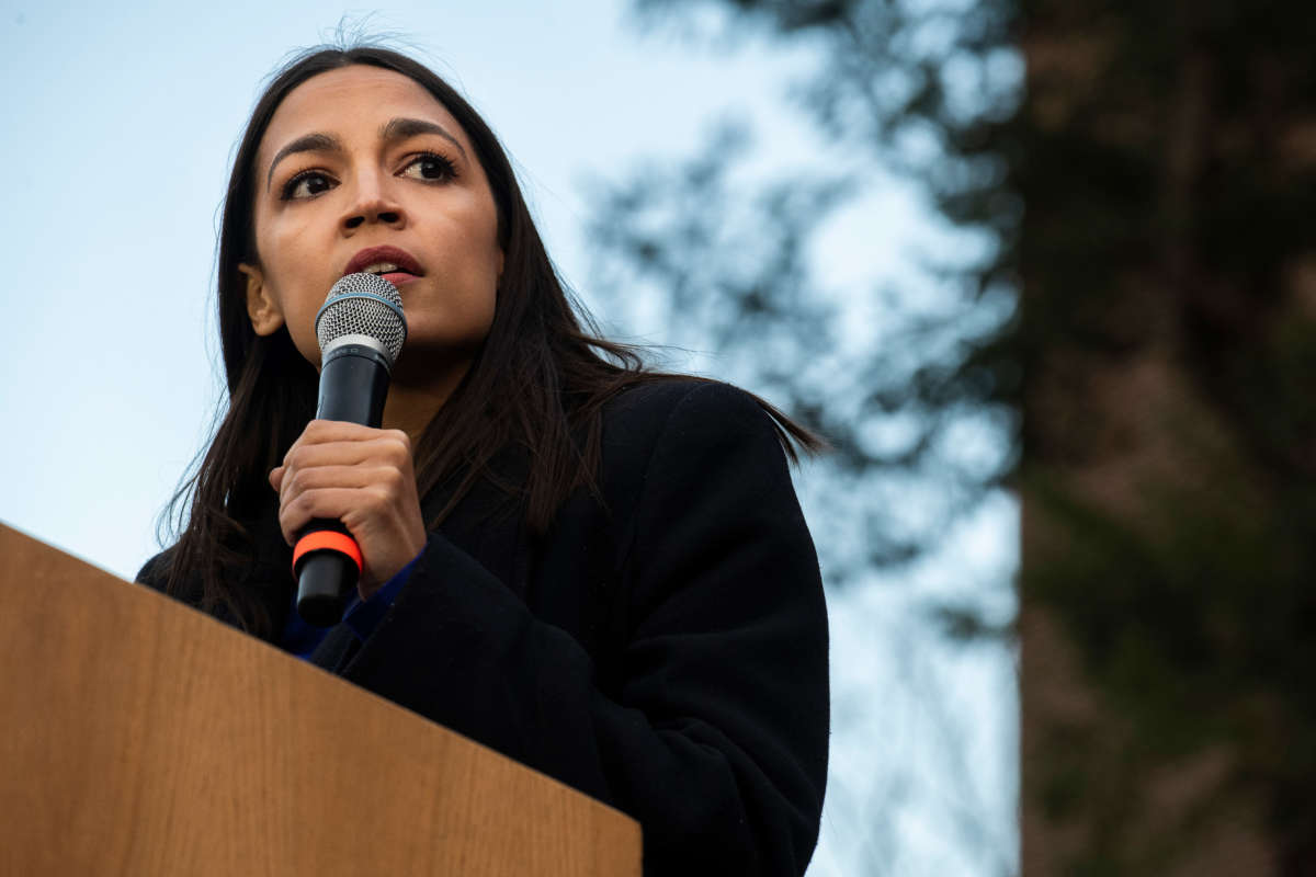 Rep. Alexandria Ocasio-Cortez addresses supporters during a campaign rally on March 8, 2020, in Ann Arbor, Michigan.