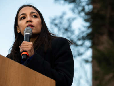 Rep. Alexandria Ocasio-Cortez addresses supporters during a campaign rally on March 8, 2020, in Ann Arbor, Michigan.