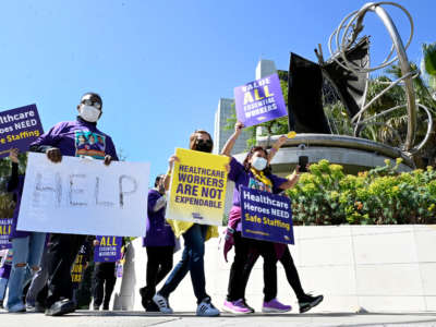Members of the Service Employees International Union-United Healthcare Workers West hold a picket line on day one of a weeklong planned strike at Cedars-Sinai Medical Center in Los Angeles, on May 9, 2022.