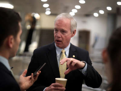 Sen. Ron Johnson talks to reporters on Capitol Hill on February 25, 2020, in Washington, D.C.