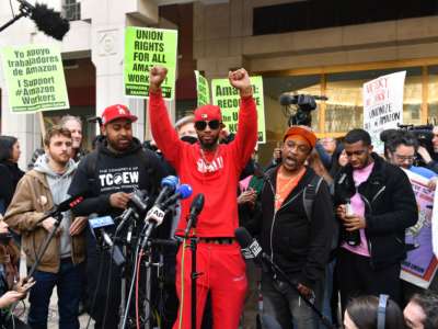 Amazon Labor Union organizer Christian Smalls (center) celebrates as he speaks following the April 1, 2022, vote for the unionization of the Amazon Staten Island warehouse in New York.