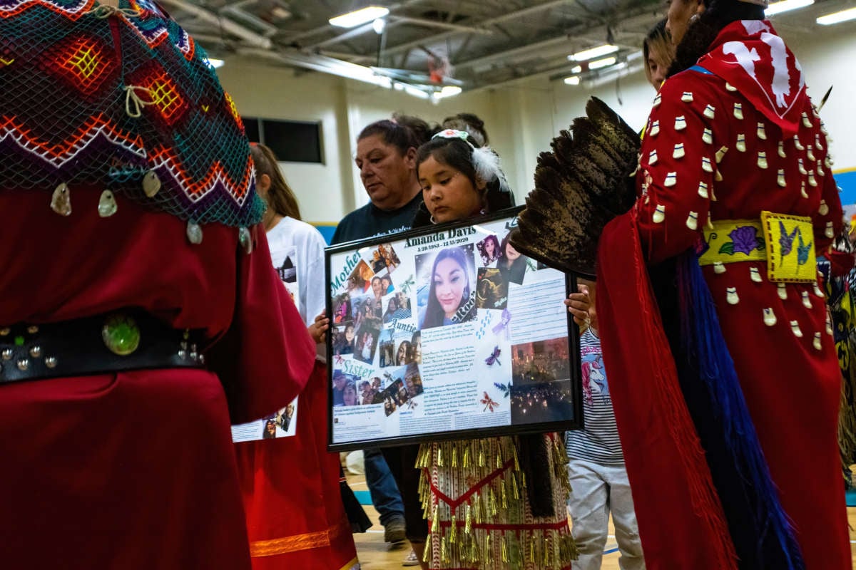 Photos of a Murdered Native woman, Anna Marie Scott, are shown at the First Annual Red Dress Powwow, which was held to bring awareness to Missing and Murdered Indigenous Women, Girls and Two-Spirit People.