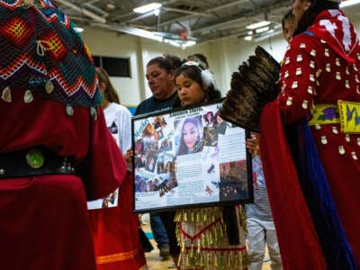 Photos of a Murdered Native woman, Anna Marie Scott, are shown at the First Annual Red Dress Powwow, which was held to bring awareness to Missing and Murdered Indigenous Women, Girls and Two-Spirit People.