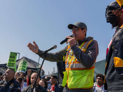 Pat Cioffi and Christian Smalls speak in front of the Amazon the LDJ-5 warehouse on Staten Island in New York on April 24, 2022.