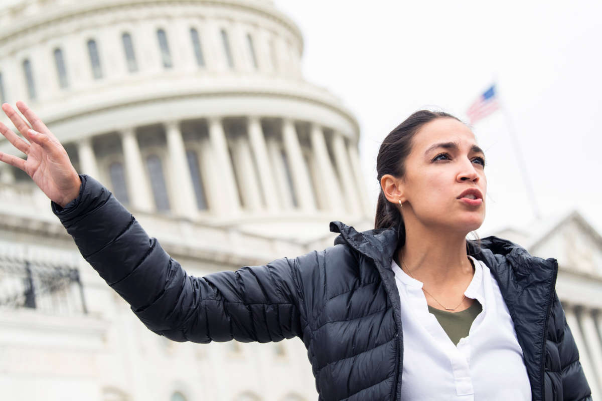 Rep. Alexandria Ocasio-Cortez is seen on the House steps of the Capitol on August 3, 2021.