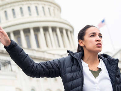 Rep. Alexandria Ocasio-Cortez is seen on the House steps of the Capitol on August 3, 2021.