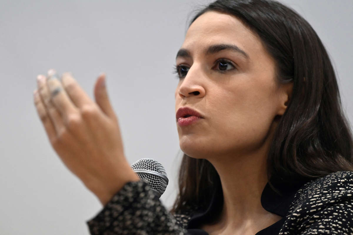 Rep. Alexandria Ocasio-Cortez speaks at an event at the U.S. Climate Action Centre on the sidelines of the COP26 UN Climate Change Conference in Glasgow on November 9, 2021.