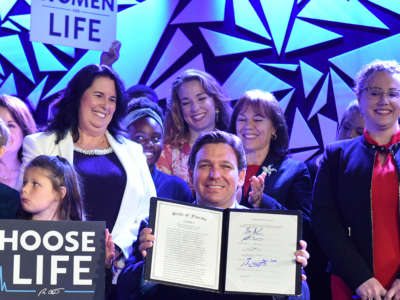 Gov. Ron DeSantis signs Florida's 15-week abortion ban into law at Nacion de Fe church in Kissimmee, Florida, on April 14, 2022.