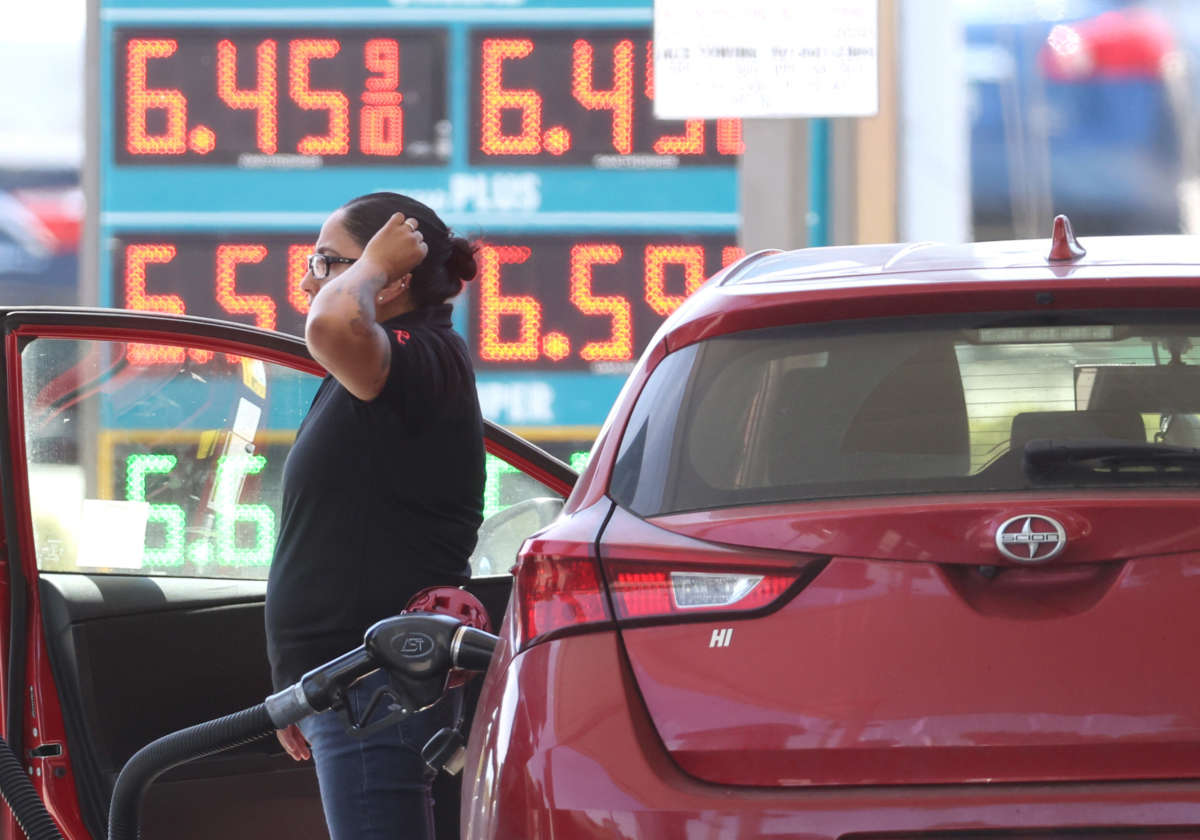 A customer pumps gas into their car at a gas station on May 18, 2022, in Petaluma, California.