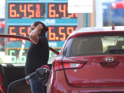 A customer pumps gas into their car at a gas station on May 18, 2022, in Petaluma, California.