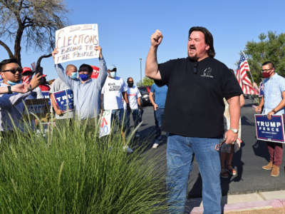 Nevada Republican Party Chairman Michael McDonald speaks to people gathered during a demonstration at the Grant Sawyer State Office Building on August 4, 2020, in Las Vegas, Nevada.