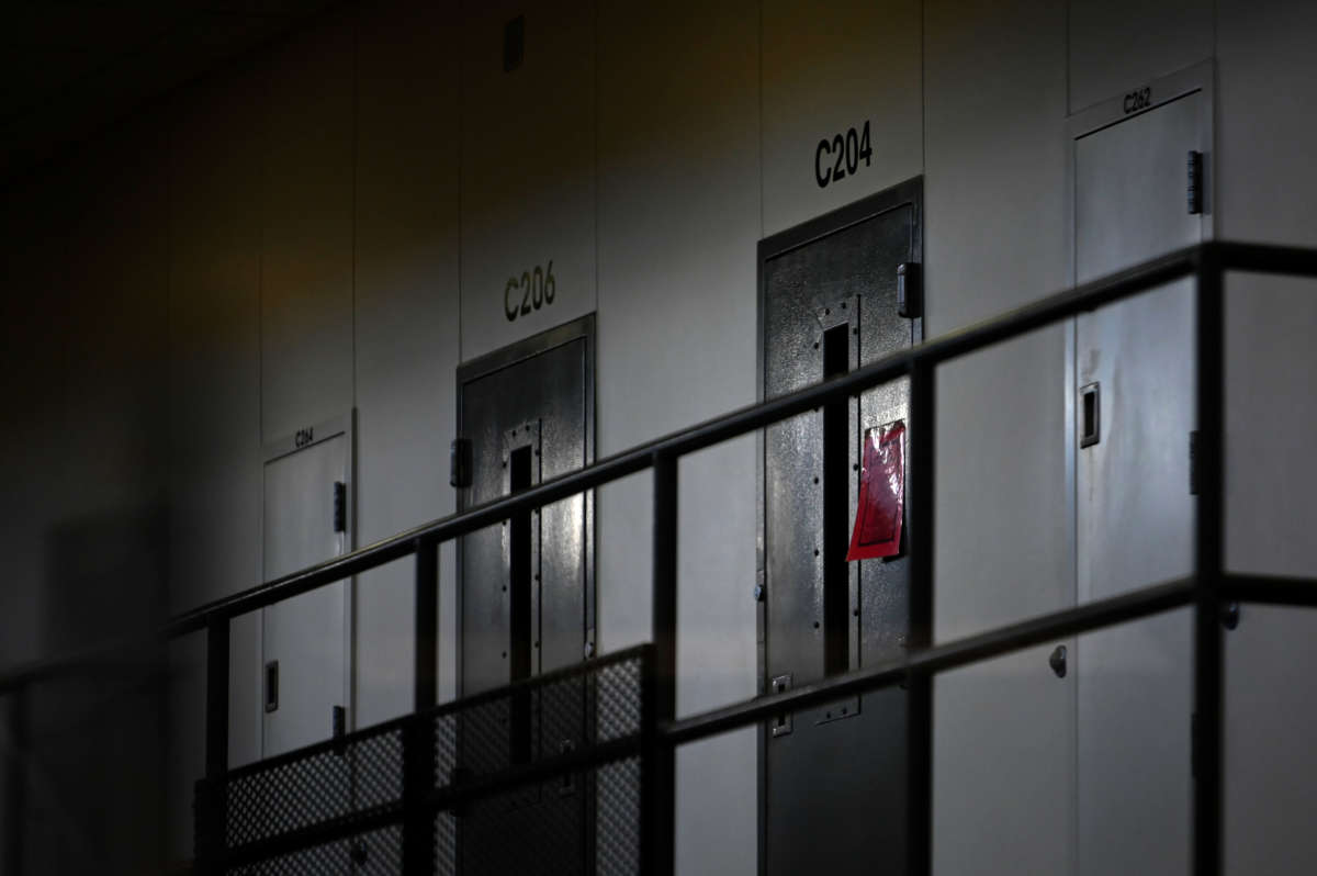 A red sign on a cell door signifies an active COVID-19 case for its inhabitants, at Faribault Prison on January 4, 2021, in Faribault, Minnesota.