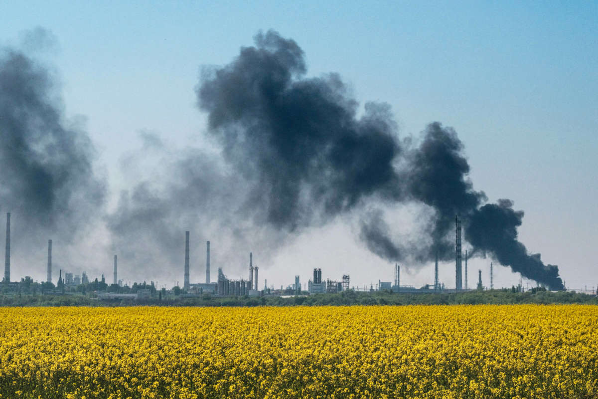 A smoke after shelling rises from an oil refinery near Lysychansk, eastern Ukraine, on May 9, 2022, on the 75th day of the Russian invasion of Ukraine.