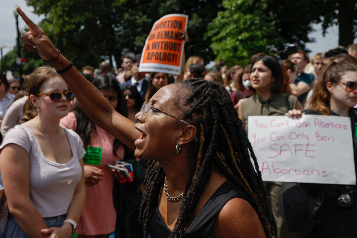 Abortion rights activists react after the announcement to the Dobbs v Jackson Women's Health Organization ruling in front of the U.S. Supreme Court on June 24, 2022, in Washington, D.C.