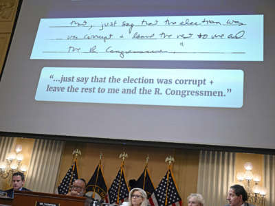 Former Acting Deputy Attorney General Richard Donoghue's handwritten notes appear onscreen during the fifth hearing by the House Select Committee to Investigate the January 6th Attack on the U.S. Capitol in the Cannon House Office Building in Washington, D.C., on June 23, 2022.