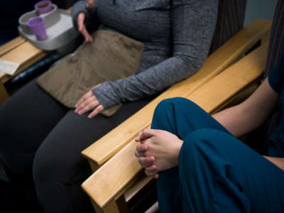 An abortion doula speaks with a patient after the patient got an abortion at an abortion clinic in Falls Church, Virginia, on November 24, 2017.