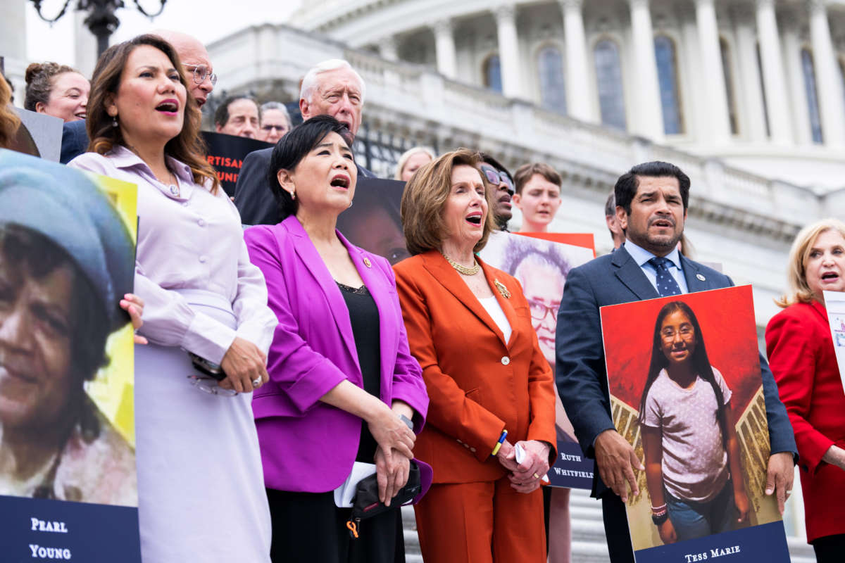 Front row from left, Reps. Veronica Escobar, Judy Chu, Speaker of the House Nancy Pelosi, Jimmy Gomez and Carolyn Maloney sing God Bless America, outside the U.S. Capitol before the House voted to pass the Bipartisan Safer Communities Act on June 24, 2022.