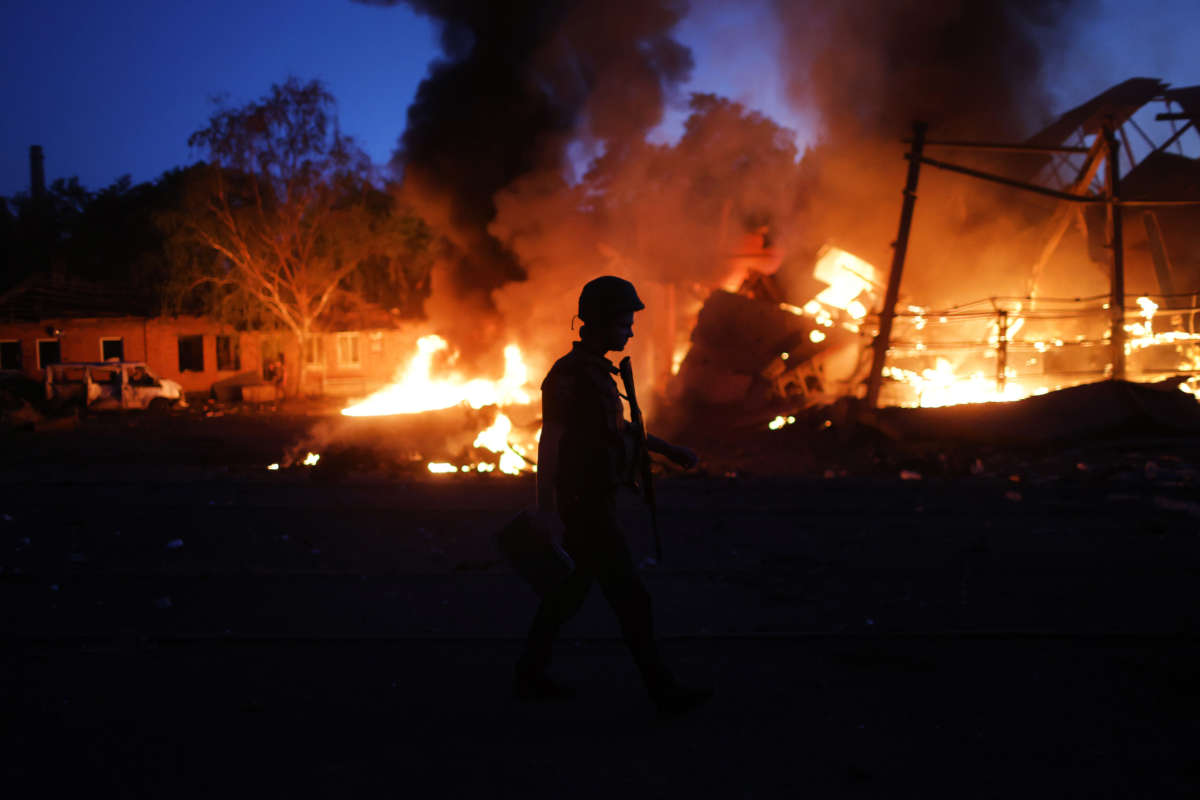 Flames rise from a structure after it was hit by a projectile on June 20, 2022, in Druzhkivka, Ukraine.