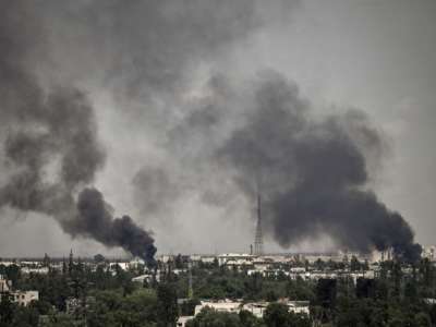 Smoke rises in the city of Severodonetsk during heavy fighting between Ukrainian and Russian troops at eastern Ukrainian region of Donbas on May 30, 2022.