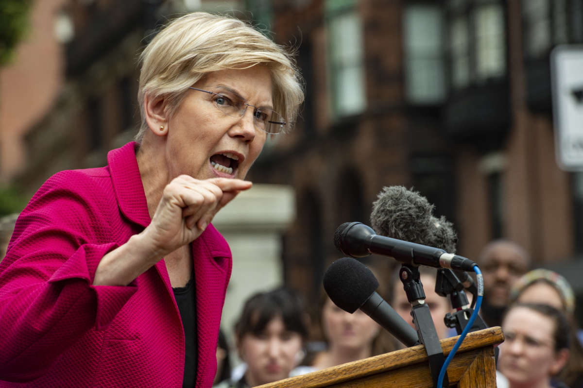 Sen. Elizabeth Warren addresses the public during a rally to protest the Supreme Court's overturning of Roe v. Wade at the Massachusetts State House in Boston, Massachusetts, on June 24, 2022.