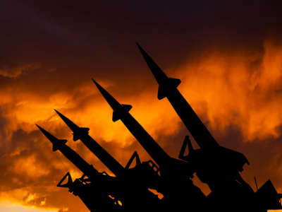 Nuclear missiles against fiery sky