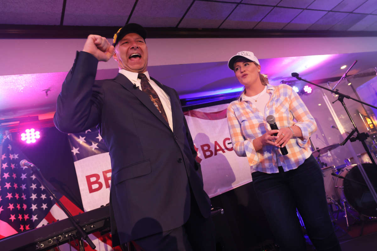 Pennsylvania Republican gubernatorial candidate Doug Mastriano greets supporters as Jenna Ellis, former Legal Advisor and Counsel to former President Donald Trump, stands on stage during his election night party at The Orchards on May 17, 2022, in Chambersburg, Pennsylvania.