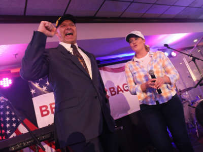 Pennsylvania Republican gubernatorial candidate Doug Mastriano greets supporters as Jenna Ellis, former Legal Advisor and Counsel to former President Donald Trump, stands on stage during his election night party at The Orchards on May 17, 2022, in Chambersburg, Pennsylvania.