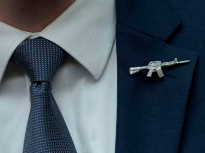 A congressional staffer wears a rifle shaped pin on his suit during a House Judiciary Committee mark up hearing on June 2, 2022, in Washington, D.C.