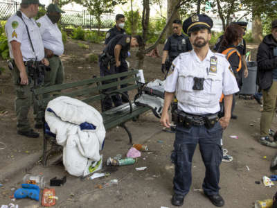 The New York City Department of Sanitation, backed up by police officers, conduct enforced removals of homeless encampments on June 23, 2022, in the Chinatown neighborhood of New York City, New York.