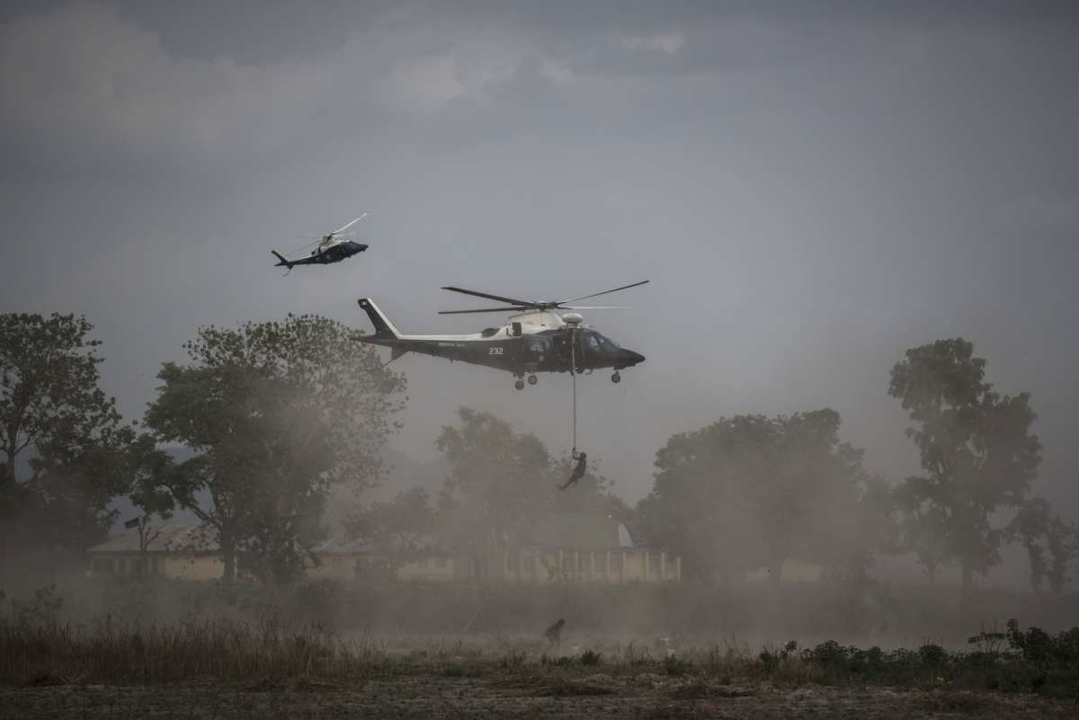 Members of the Nigerian Special Forces Unit rappel from a helicopter during the African Land Forces Summit (ALFS) military demonstration held at General AO Azazi barracks in Gwagwalada, Nigeria, on April 17, 2018.