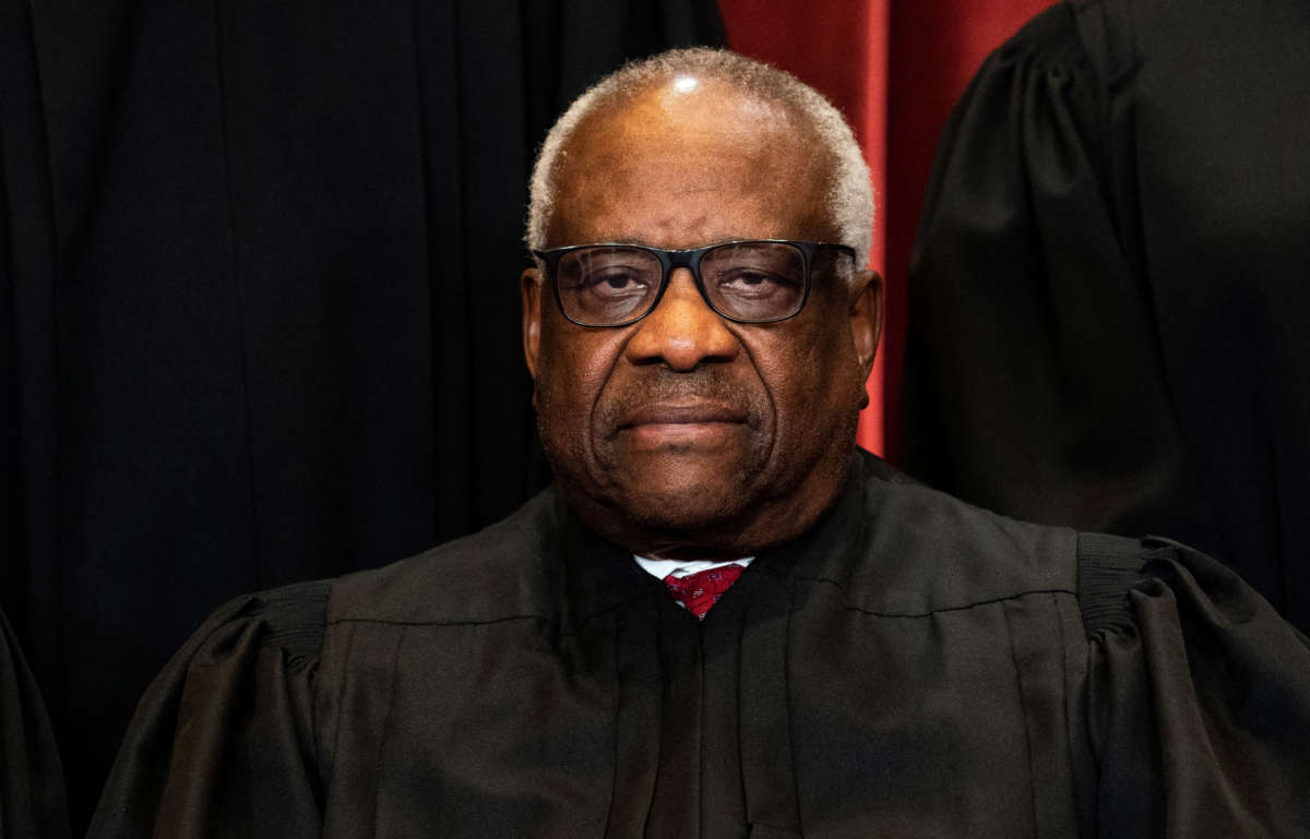 Associate Justice Clarence Thomas sits during a group photo of the Justices at the Supreme Court in Washington, D.C. on April 23, 2021.